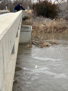 A Lincoln Water System employee samples river water to analyze source water quality