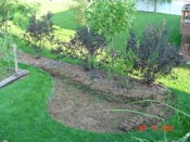 Use the excess soil to create a berm