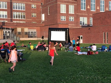 The crowd gathers before a movie starts at Irvingdale Park in 2019.