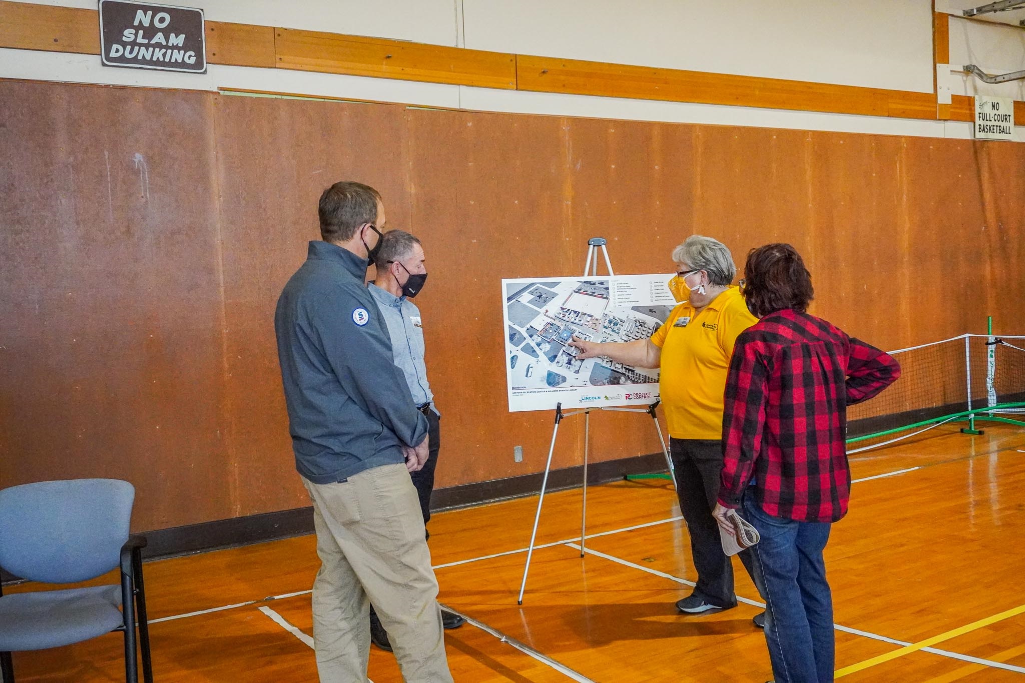 recreation staff explain new building sections to visitors
