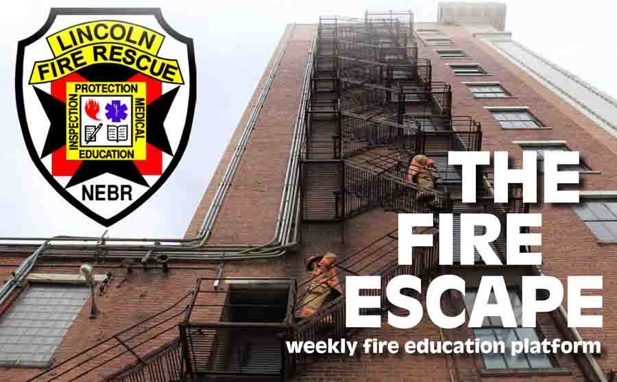 Firefighters going down a fire escape