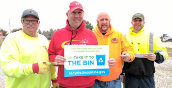 Collectors holding sign