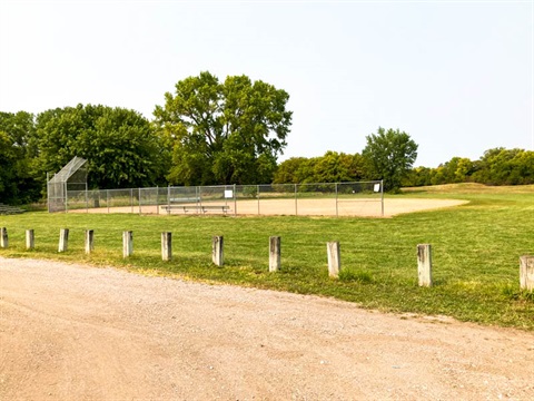 Pine Lake ballfield is located near the parking lot and an established tree line.