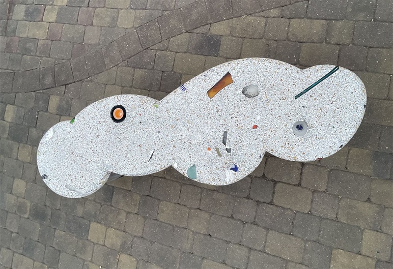 Looking down at the bench fully reveals the cloud shape made of terrazzo 