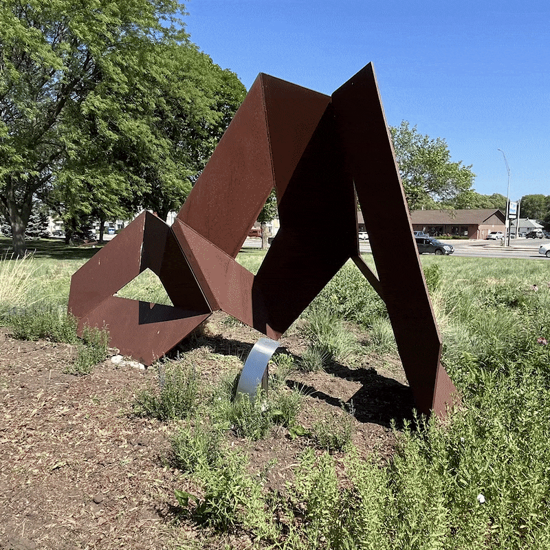 A ping-pong style gif going back and forth between two sides of the sheet metal sculpture, Dementia