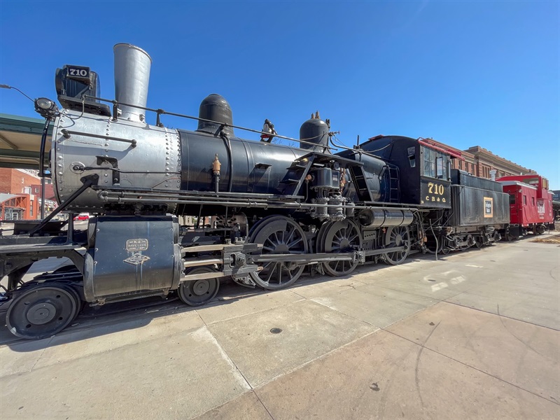 A black and silver steam engine train. 