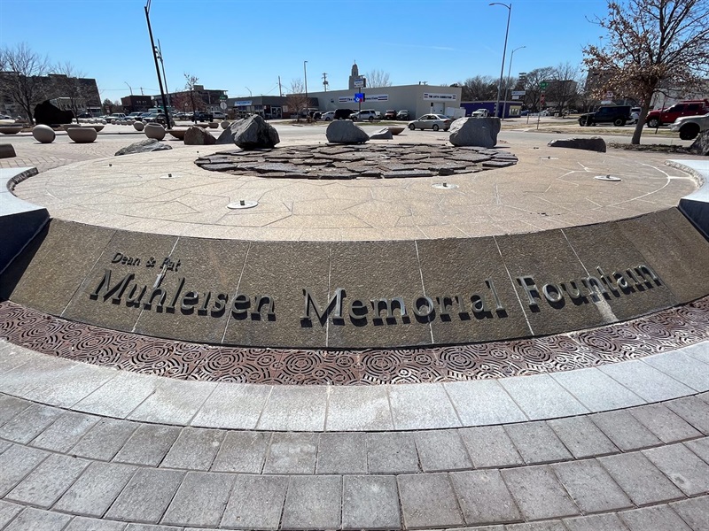 A detail of the raised letters showing the title of the fountain saying Dean & Pat Mulheisen Memorial Fountain.
