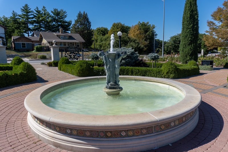 The Joy Fountain full of water, with the sculpture Joy in the center
