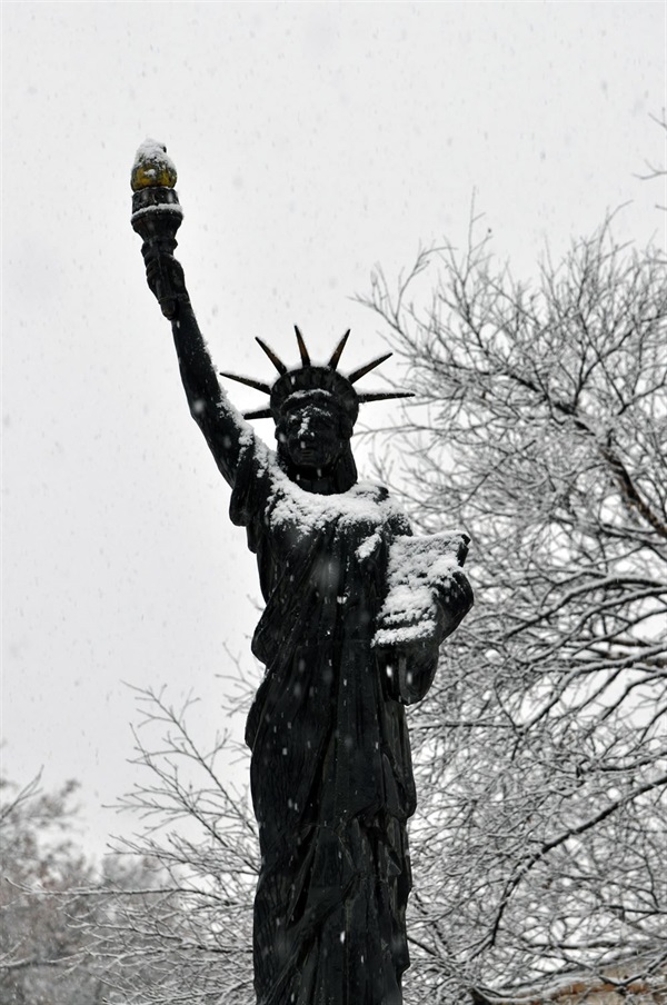 lincoln's replica of the statue of liberty covered in snow