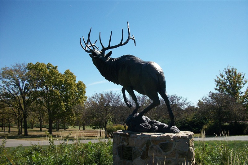 a bronze elk statue at Pioneers Park