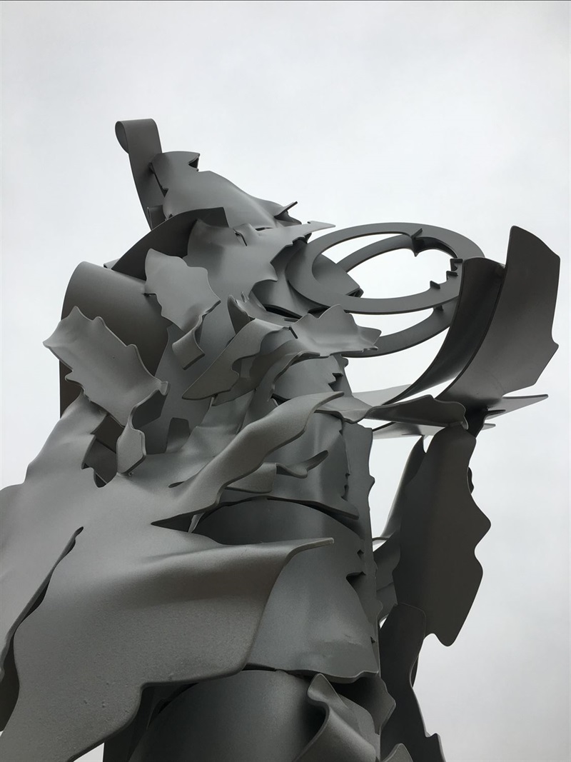 A collection of sharp and folded metal forming an abstract sculpture