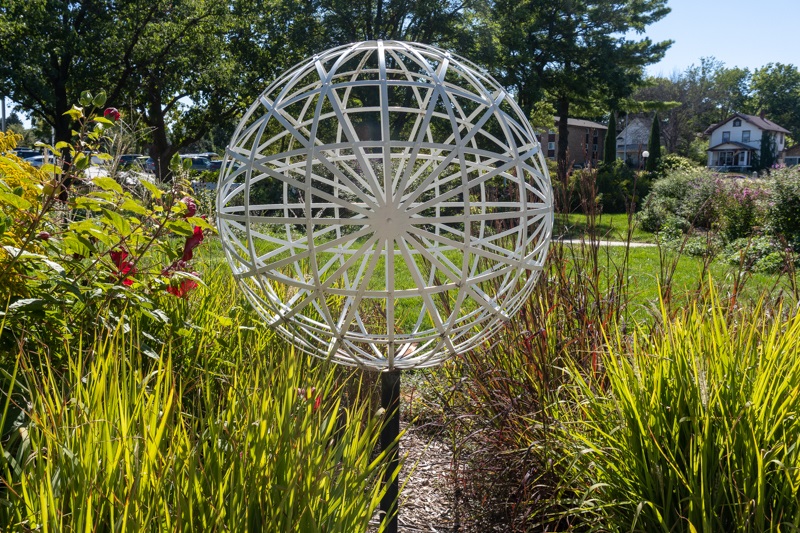 A close shot of one of the Spheres that rise from the grasses and flowers in the Hamann Rose Garden