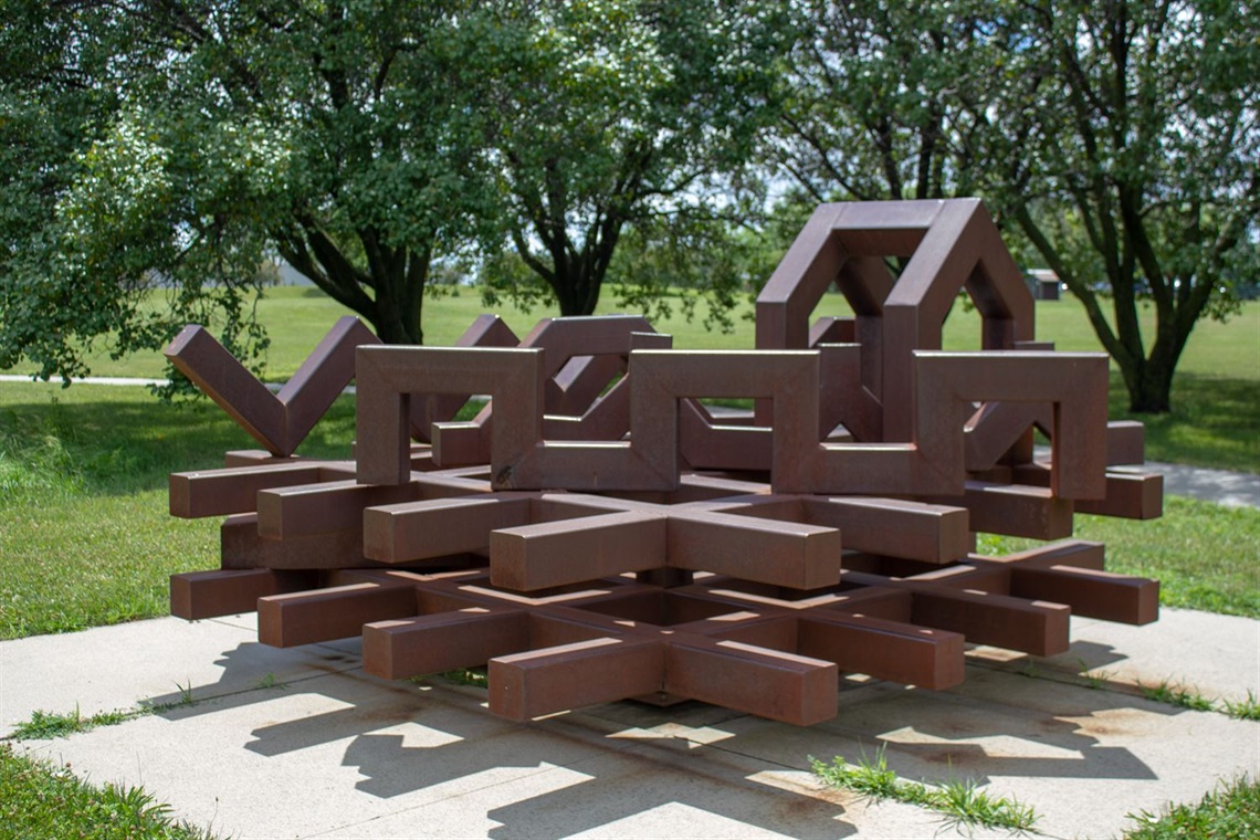 A large cast steel sculpture made of geometric lines and shapes