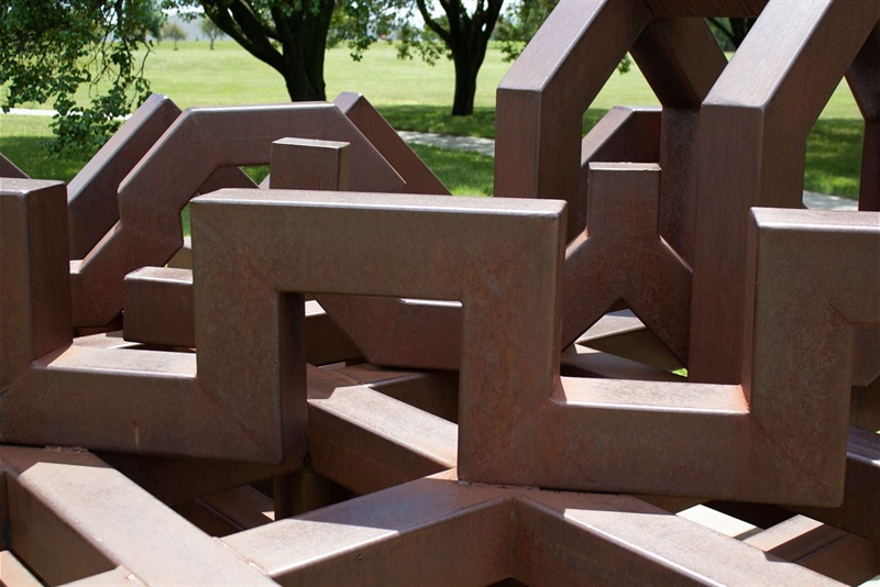 A close up of the geometric metal forms and lines that form the sculpture, Where the Sky Meets the Earth