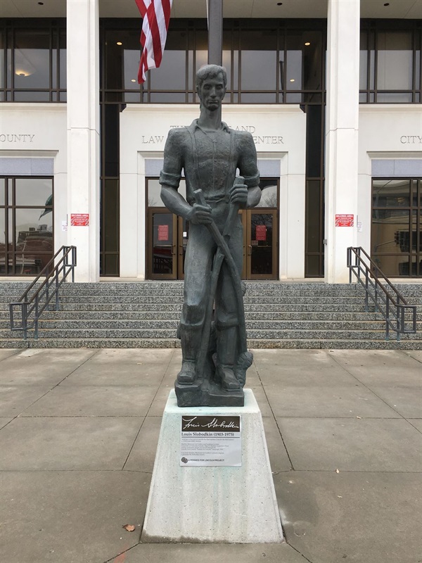 A statue of a young Abraham Lincoln as a rail joiner