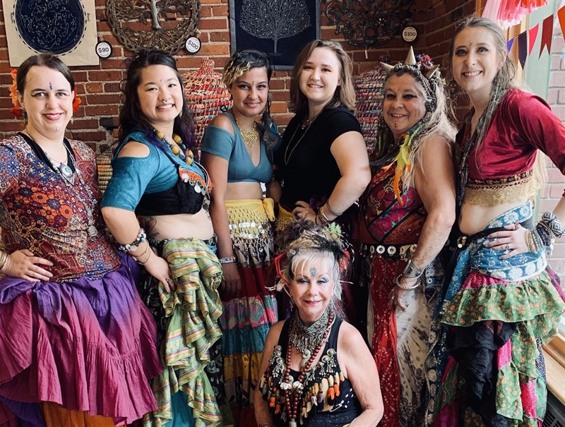 The Bellajhara Belly Dance Troupe, in their bright tribal dance outfits.