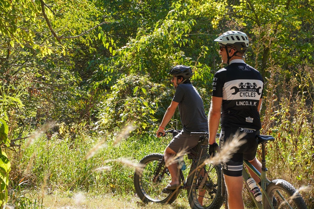 Two bikers prepare for the course ahead of them on the mountain bike trail