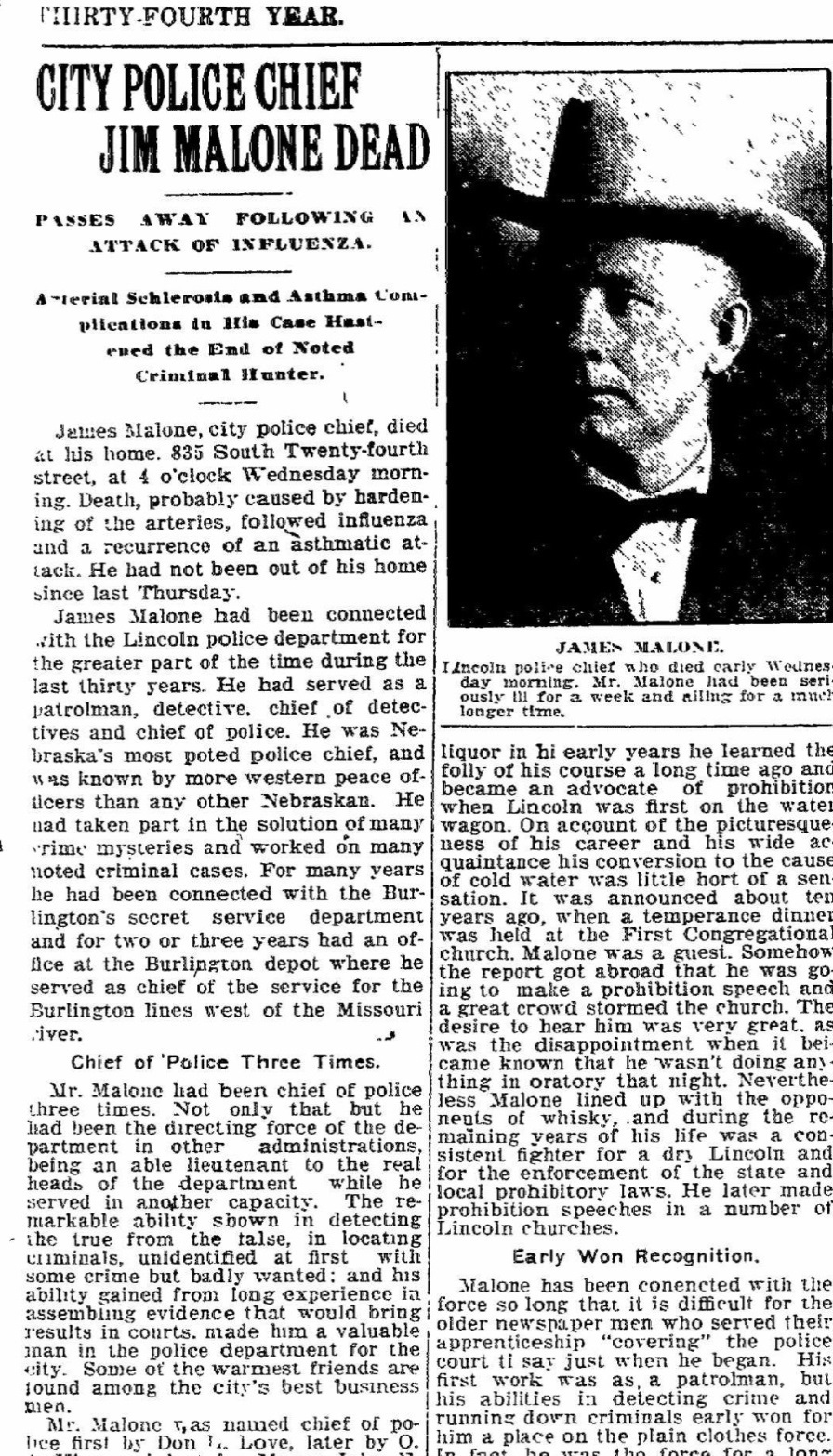 Newspaper clipping with headline 'City Police Chief Jim Malone Dead'