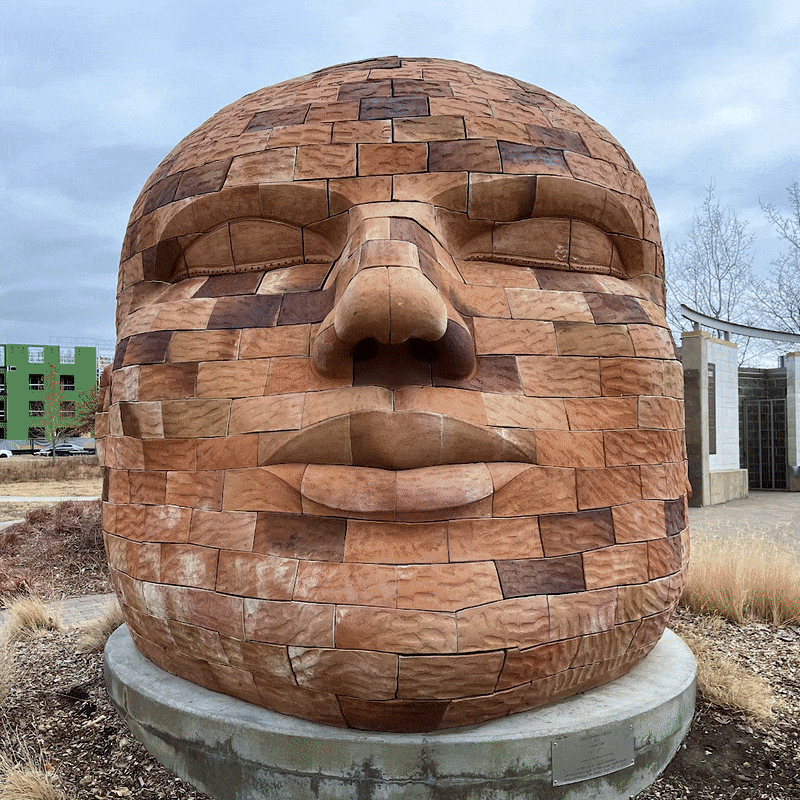 A rotating gif around the giant brick head, groundwater colossus.