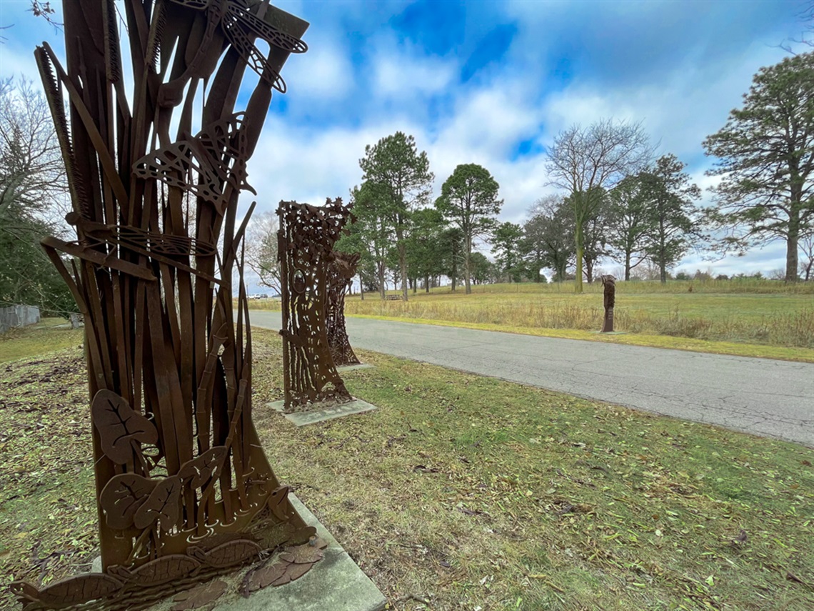 The four welded metal entry panels the welcome guests to the Pioneers Park Nature Center.