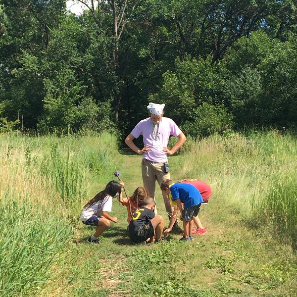 Nature Center campers explore the ecosystem they walk on.