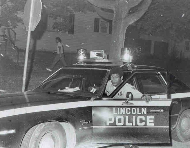 Officer Lee exiting his cruiser