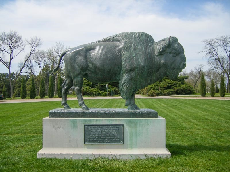 The bronze bison statue welcomes visitors to Pioneer's Park.